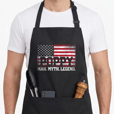 Poppy myth father day apron - Distressed USA flag with POPPY text and MAN MYTH LEGEND slogan in white and grey — shown on a black cotton canvas apron against a white background