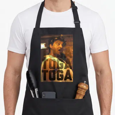Bluto animal apron - Man in toga with four stacked TOGA words in black outline — shown on a black cotton canvas apron against a white background
