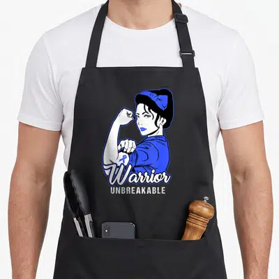 Warrior colon cancer awareness apron - Cartoon woman flexing arm with blue ribbon and Warrior Unbreakable text — shown on a black cotton canvas apron against a white background