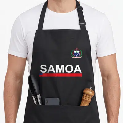 Sport samoa apron - SAMOA text and coat of arms with FA'AVAE I LE ATUA SAMOA motto and red flag strip — shown on a black cotton canvas apron against a white background