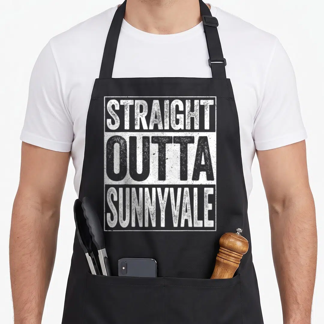 Straight sunnyvale apron - Stacked white text reading STRAIGHT OUTTA SUNNYVALE inside a grey rectangle border — shown on a black cotton canvas apron against a white background
