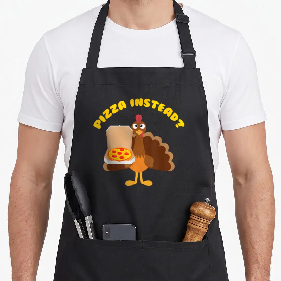 Pizza turkey apron - Cartoon turkey holding pizza box under PIZZA INSTEAD? text — shown on a black cotton canvas apron against a white background