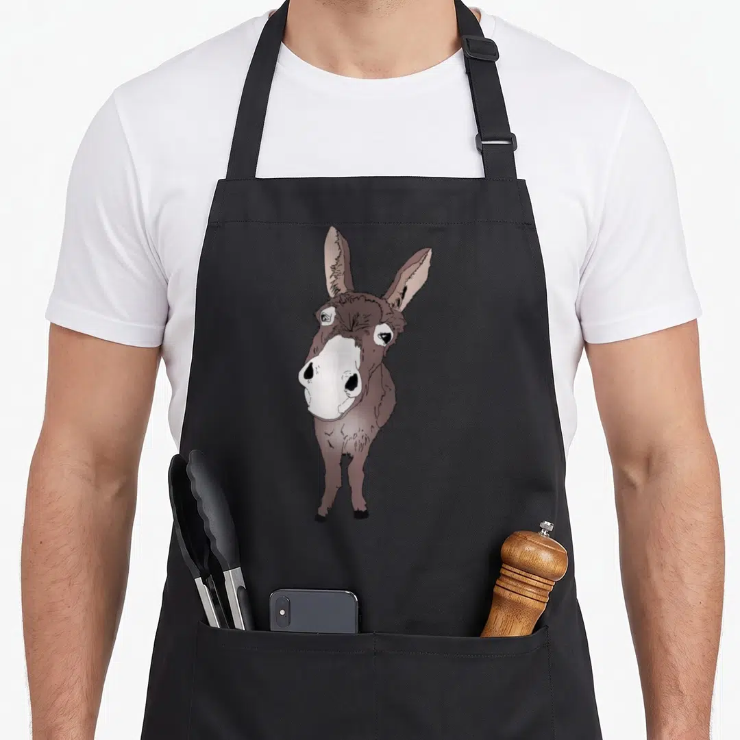 Donkey horse apron - Realistic brown and white donkey standing centered on grey background — shown on a black cotton canvas apron against a white background