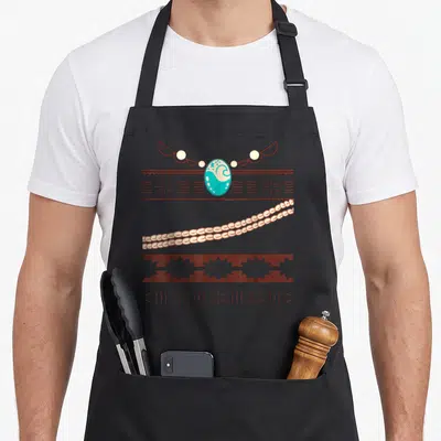 Princess kitchen island apron - Minimalist necklace with turquoise pendant, cream beads, and brown patterned bands — shown on a black cotton canvas apron against a white background