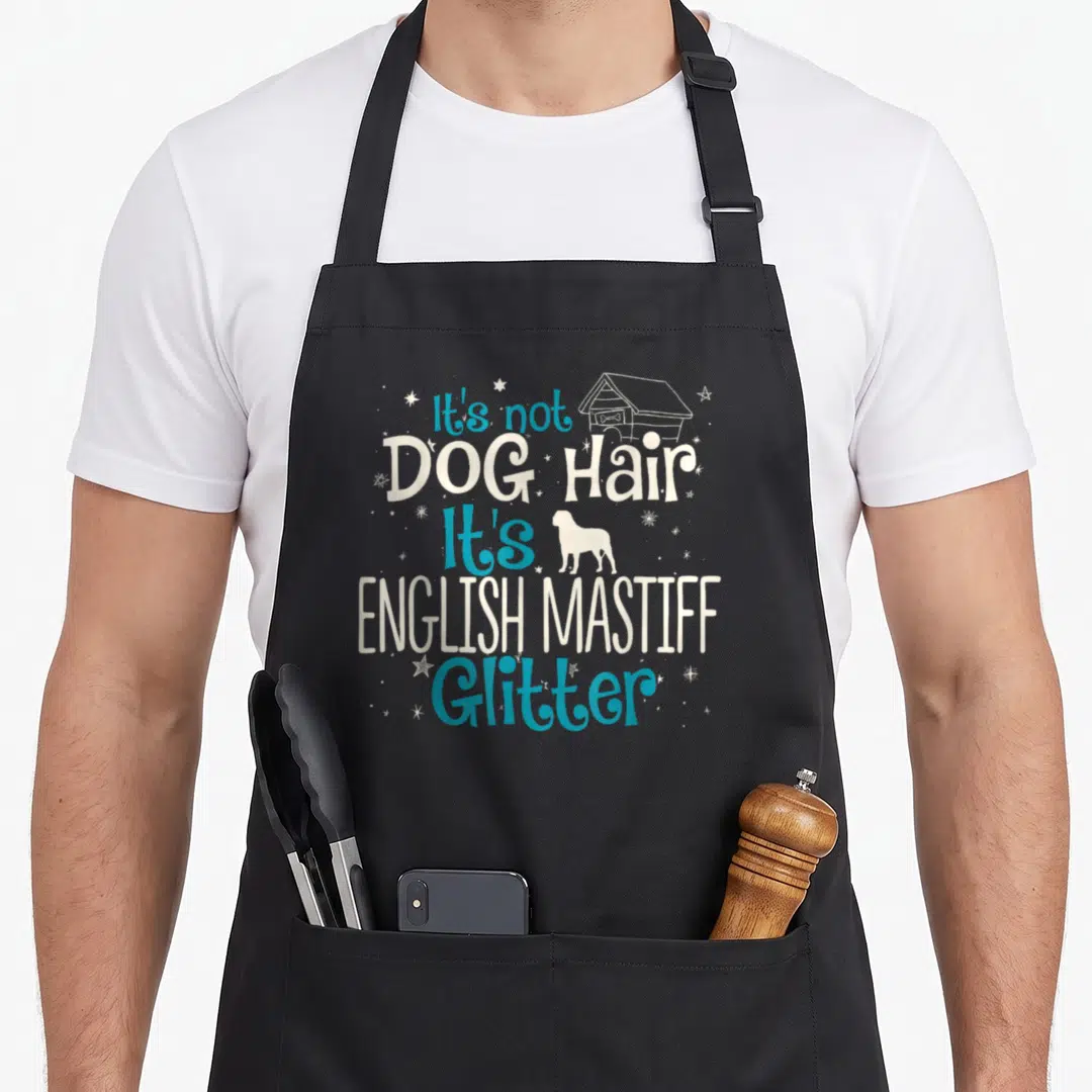 Hair english dog apron - It's not DOG Hair It's ENGLISH MASTIFF Glitter text with dog house and mastiff silhouette — shown on a black cotton canvas apron against a white background