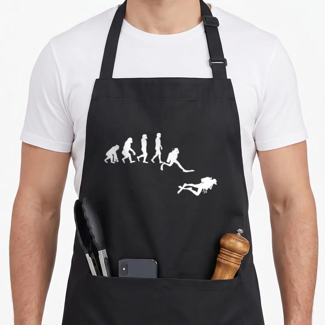 Dive diving apron - Six white silhouettes of evolution ending with a falling scuba diver — shown on a black cotton canvas apron against a white background