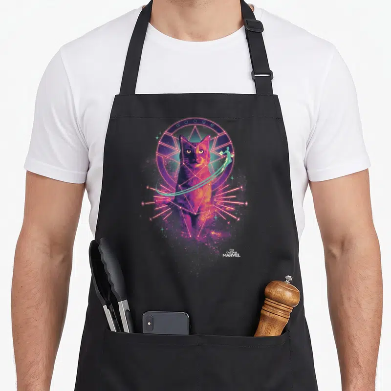Captain goose apron - Realistic cat in pink geometric circle with teal GOOSE text and flying figure — shown on a black cotton canvas apron against a white background