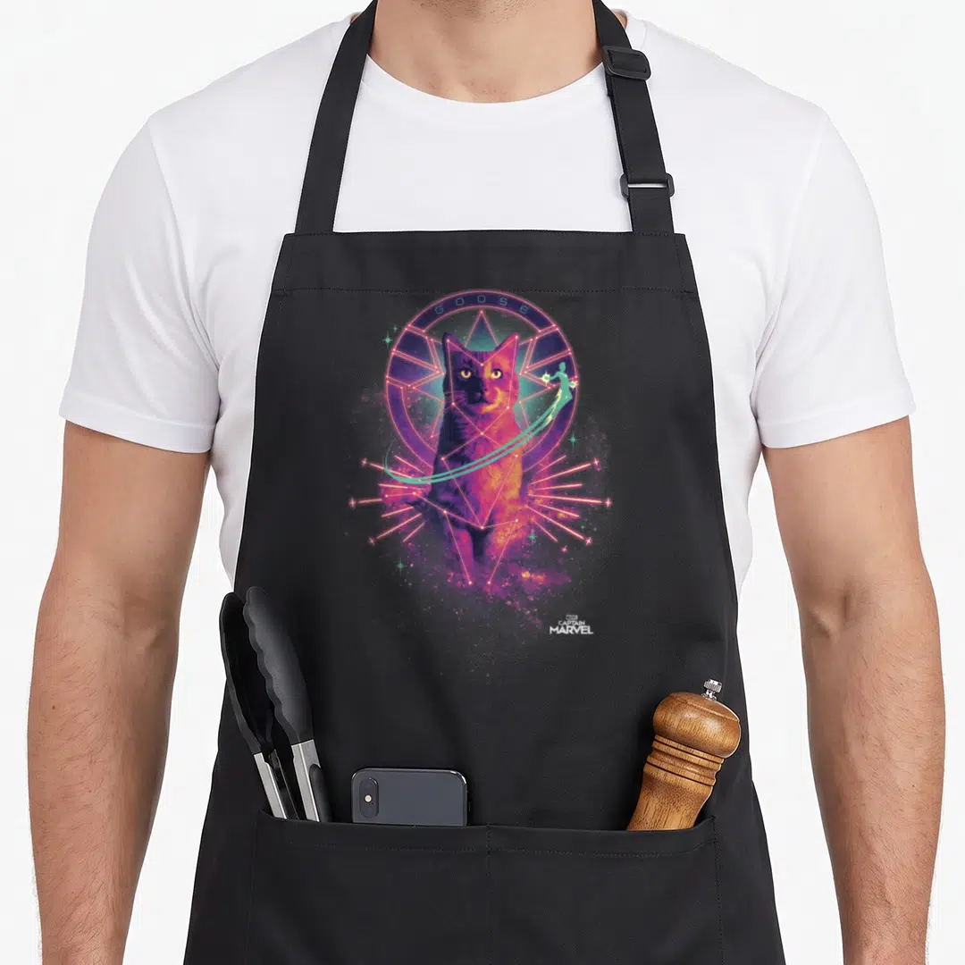 Captain goose apron - Realistic cat in pink geometric circle with teal GOOSE text and flying figure — shown on a black cotton canvas apron against a white background