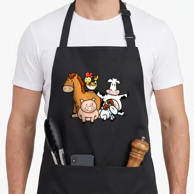Young farmers apron - Five cartoon farm animals including a brown horse, pink pig, spotted cow, yellow chicken — shown on a black cotton canvas apron against a white background
