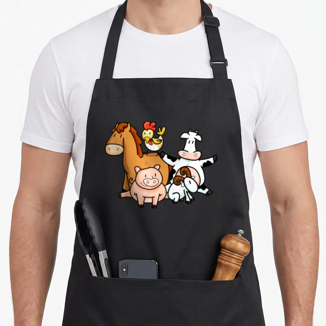 Young farmers apron - Five cartoon farm animals including a brown horse, pink pig, spotted cow, yellow chicken — shown on a black cotton canvas apron against a white background