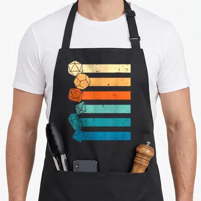 Rpg game aprons - Six stacked polyhedral dice in beige orange red teal and blue overlapping horizontal stripes — shown on a black cotton canvas apron against a white background