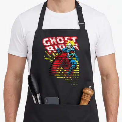 Ghost split apron - Stacked GHOST RIDER text above glitch-sliced motorcycle character in red blue yellow white cartoon — shown on a black cotton canvas apron against a white background