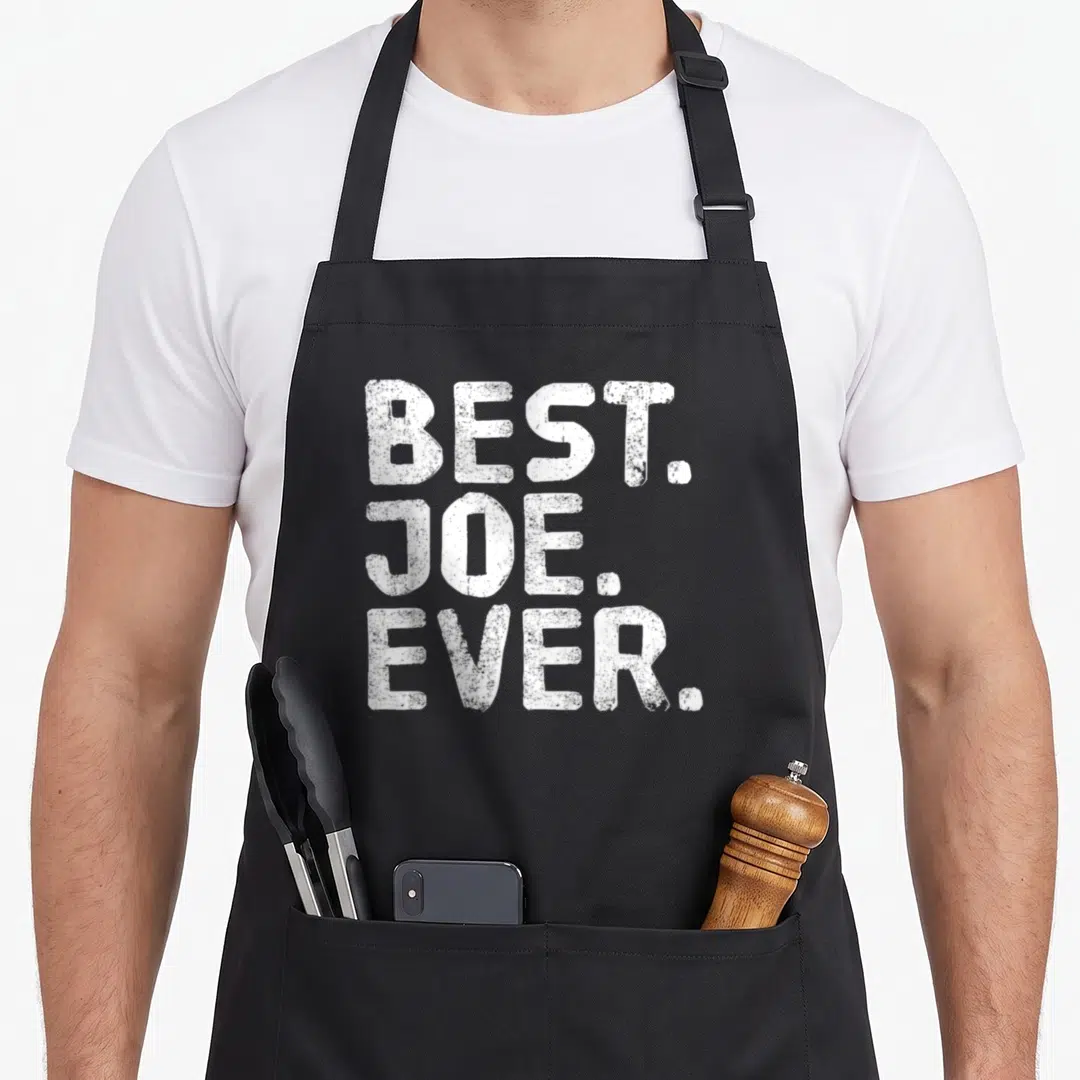 Joe figure quotes apron - White stacked text reading BEST. JOE. EVER. in a distressed block font — shown on a black cotton canvas apron against a white background