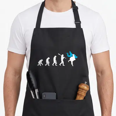 Evolution judo apron - Five white silhouettes evolving into a judo throw with a blue figure — shown on a black cotton canvas apron against a white background