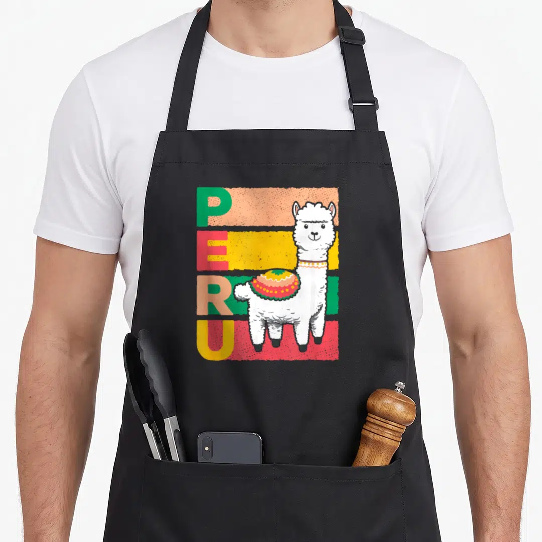 Sweet peruvian apron - Cartoon llama with decorative blanket standing near vertical PERU text over colored stripes — shown on a black cotton canvas apron against a white background