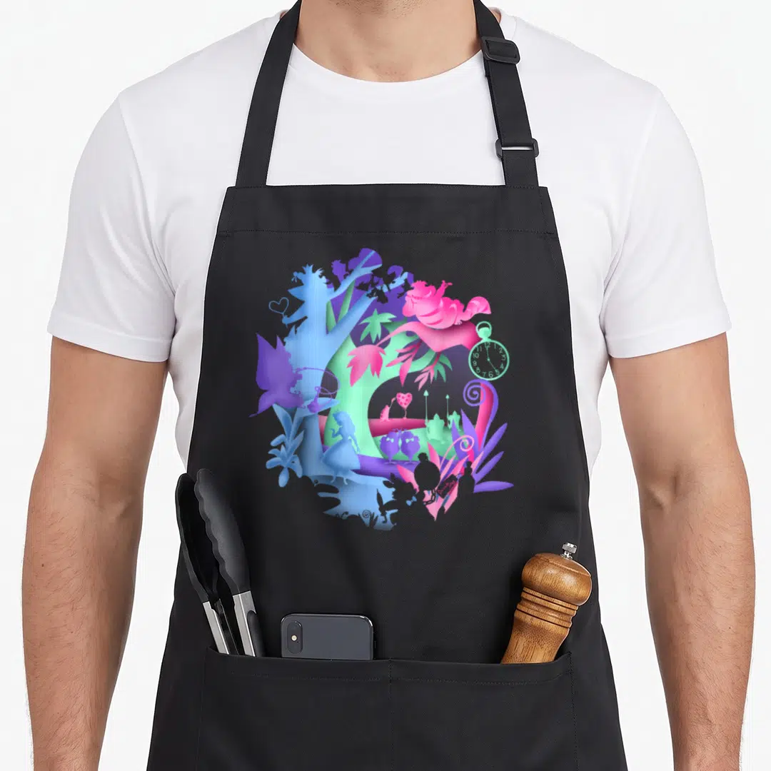Neon alice wonderland apron - Circular paper cut silhouette art of Alice characters in purple blue pink and green — shown on a black cotton canvas apron against a white background