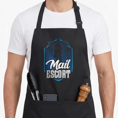 Escort mailman postal aprons - Blue shield with mail carrier silhouette and white distressed Mail ESCORT text — shown on a black cotton canvas apron against a white background