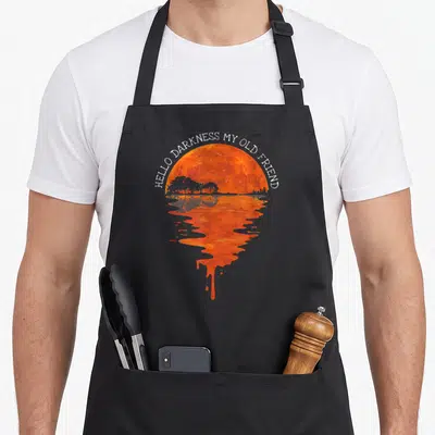 Hello hippie apron - Arched white text over orange sun with dripping reflection on black apron — shown on a black cotton canvas apron against a white background