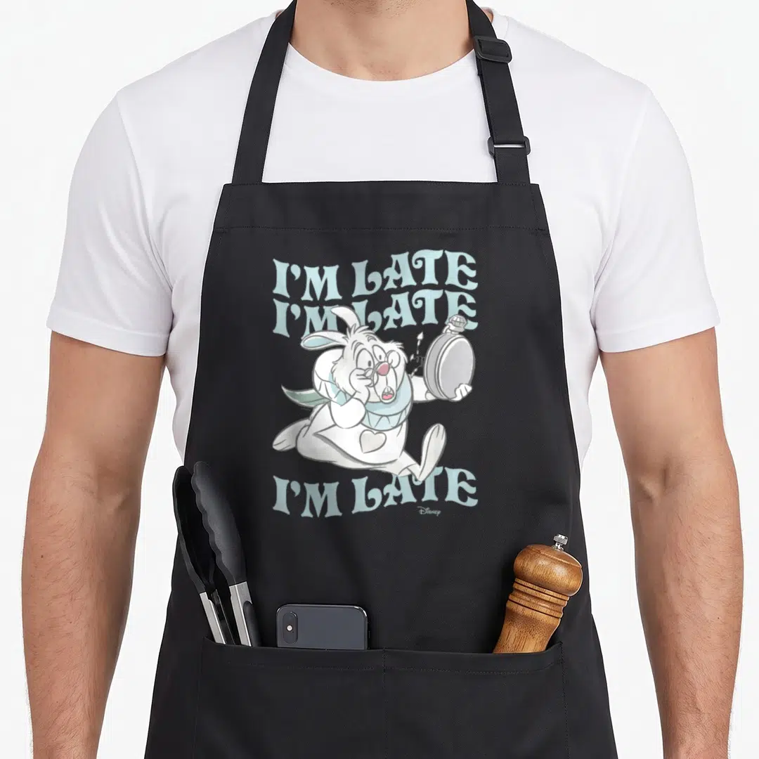 Late alice wonderland apron - White Rabbit holding pocket watch with I'M LATE text in light blue and grey cartoon style — shown on a black cotton canvas apron against a white background