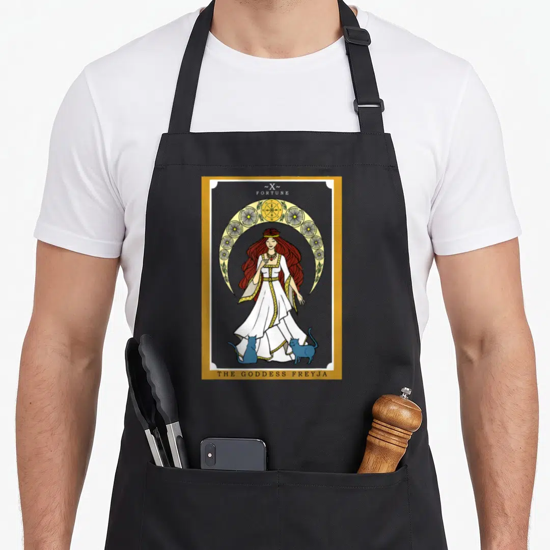 Norse cat apron - Freyja goddess tarot card with two blue cats and gold circular frame border — shown on a black cotton canvas apron against a white background