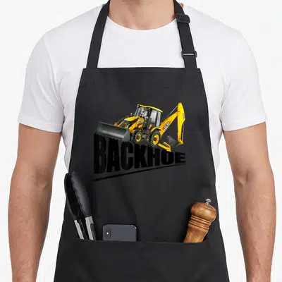 Equipment backhoe heavy apron - Yellow JCB backhoe loader photo above bold black BACKHOE text — shown on a black cotton canvas apron against a white background