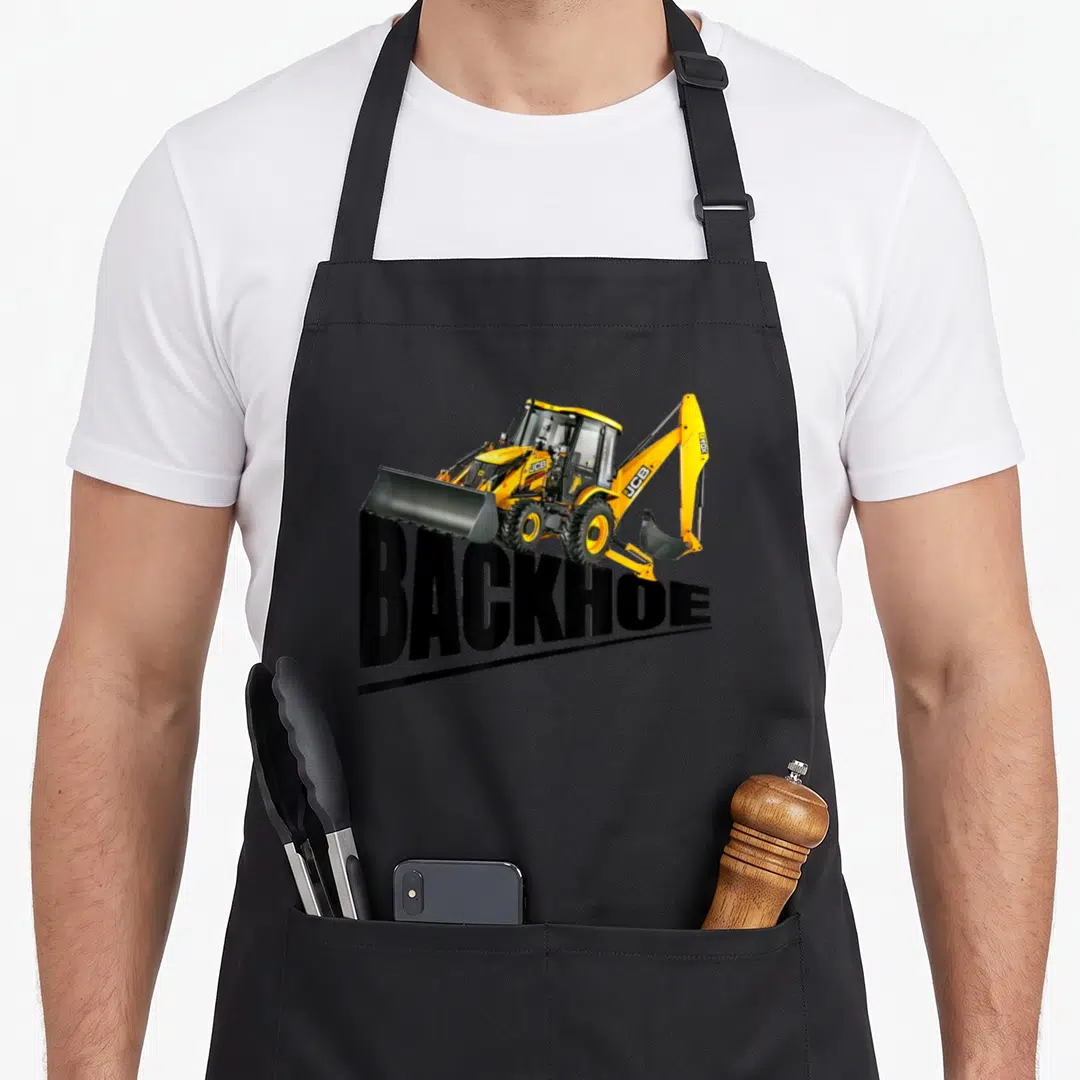 Equipment backhoe heavy apron - Yellow JCB backhoe loader photo above bold black BACKHOE text — shown on a black cotton canvas apron against a white background