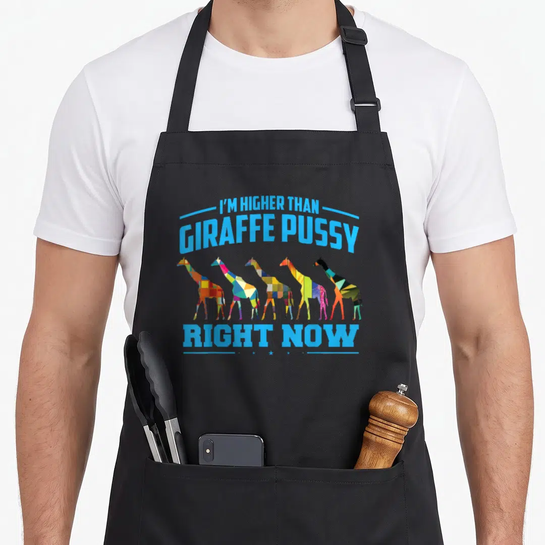 Weed mens joke aprons - Five multicolored giraffes standing below blue text reading I'm Higher Than Giraffe Pussy Right — shown on a black cotton canvas apron against a white background