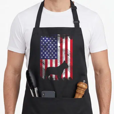 Frenchie 4th of july apron - Grey dog silhouette standing in front of a distressed red white and blue American flag — shown on a black cotton canvas apron against a white background