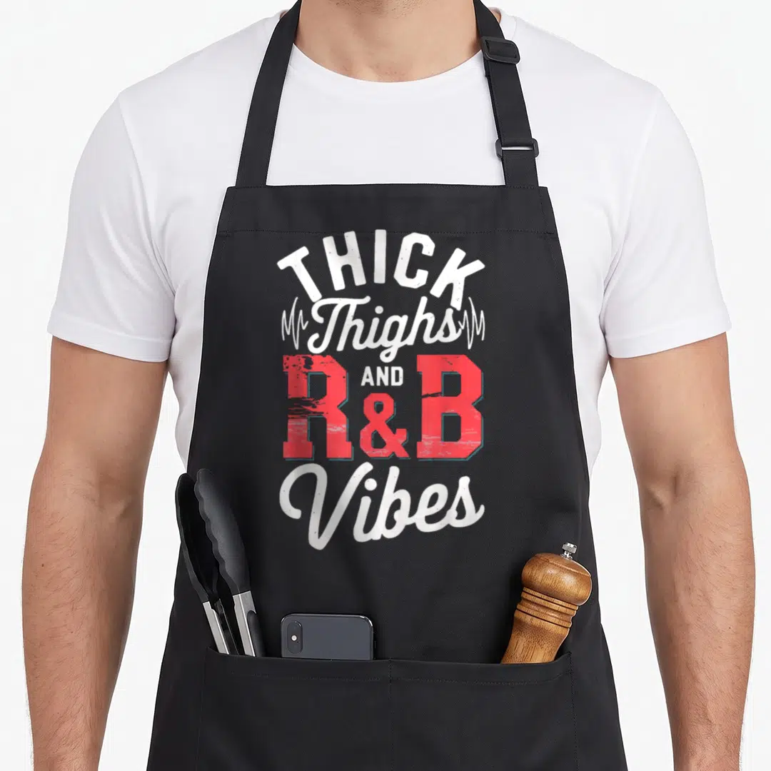 Thigh r aprons - THICK Thighs AND R&B Vibes text with heartbeat lines in white and red — shown on a black cotton canvas apron against a white background