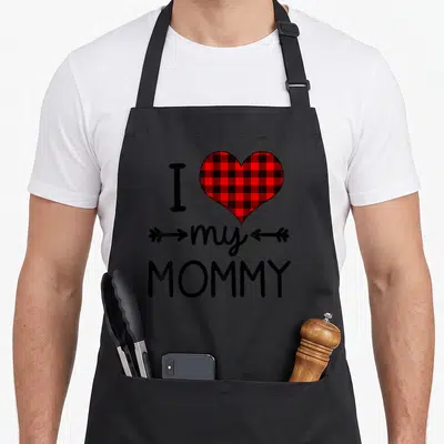 Plaid valentine's day apron - I my MOMMY text with red black plaid heart and arrows — shown on a black cotton canvas apron against a white background