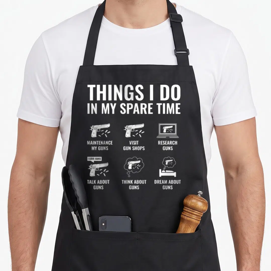 Spare gun apron - White handgun icons and text listing maintenance and shop visits — shown on a black cotton canvas apron against a white background