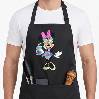 Unicorn pineapple apron - Minnie Mouse holding drink in striped swimsuit with pink bow and yellow glasses — shown on a black cotton canvas apron against a white background