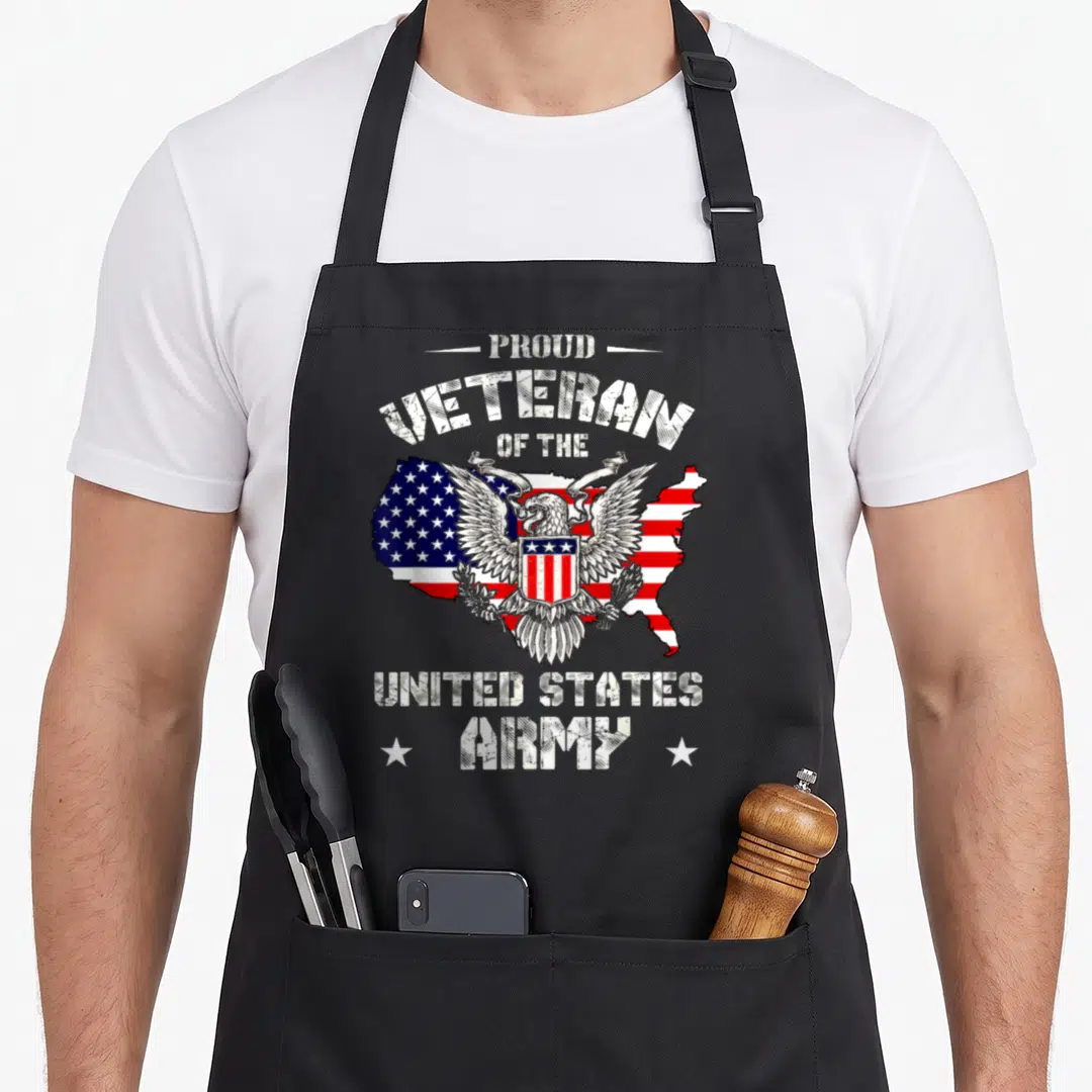 Proud us aprons - Distressed text Proud Veteran United States Army above and below eagle on US flag map — shown on a black cotton canvas apron against a white background