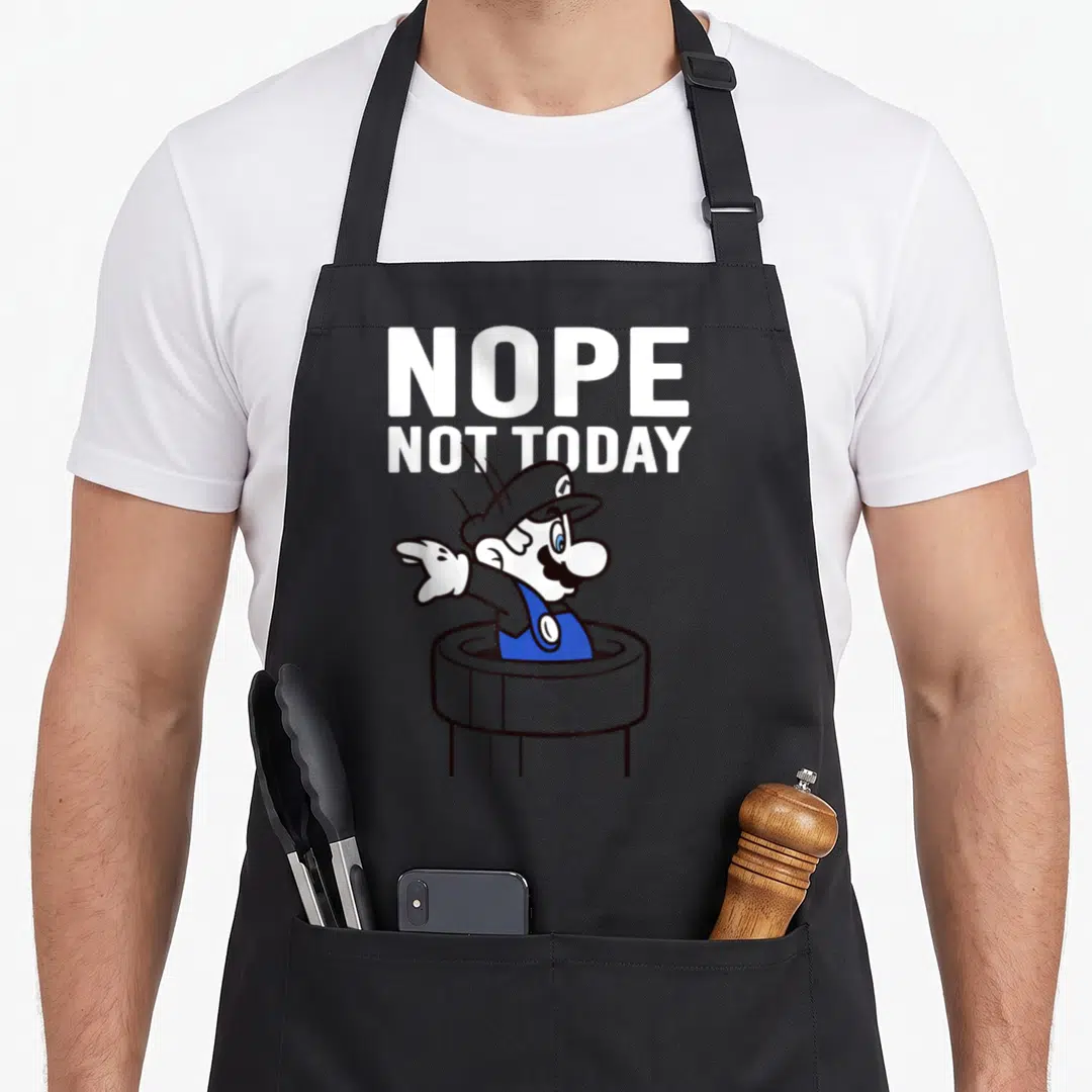 Warp not today apron - Stacked NOPE NOT TODAY text above cartoon Mario pointing left from a grey pipe — shown on a black cotton canvas apron against a white background