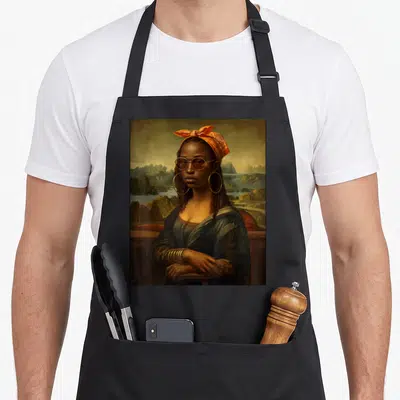 Braid african american aprons - Realistic woman with braids, orange bandana, gold bangles, hoop earrings, mountain — shown on a black cotton canvas apron against a white background