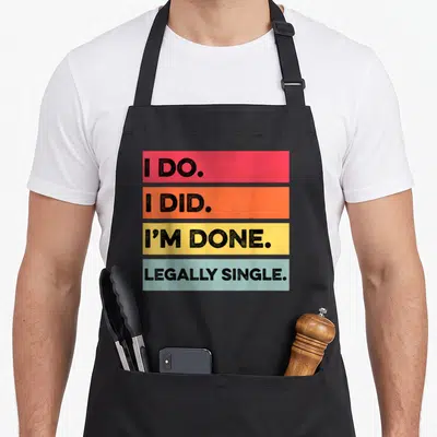 Legally divorce party apron - Four stacked colored bars reading I DO, I DID, I'M DONE, and LEGALLY SINGLE in black text — shown on a black cotton canvas apron against a white background