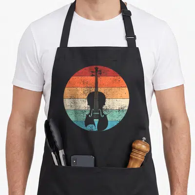 Musical violinist violin themed accessories stuff apron - Grey cello silhouette over red orange yellow cream teal blue — shown on a black cotton canvas apron against a white background