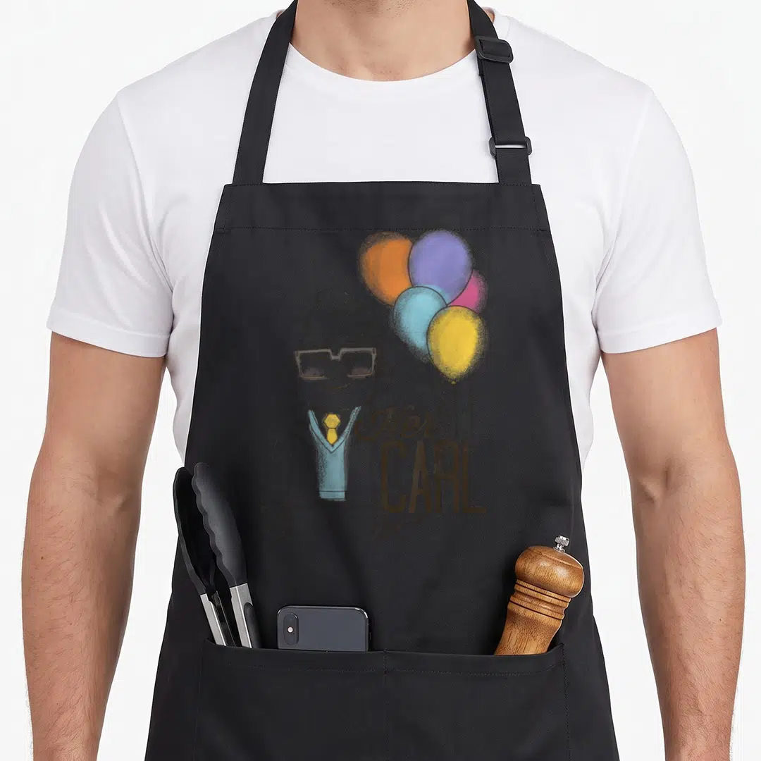 Carl couple apron - Cartoon man holding orange blue yellow purple balloons with Her CARL text overlay — shown on a black cotton canvas apron against a white background
