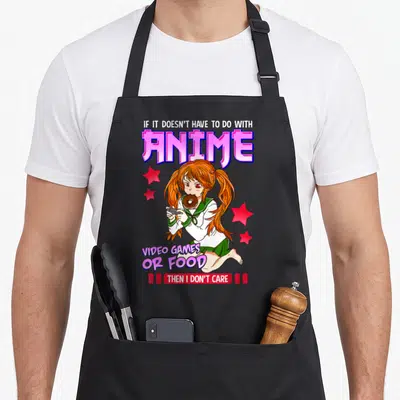 Care video game apron - Anime girl eating donut holding controller with text IF IT DOESN'T HAVE TO DO WITH ANIME VIDEO — shown on a black cotton canvas apron against a white background