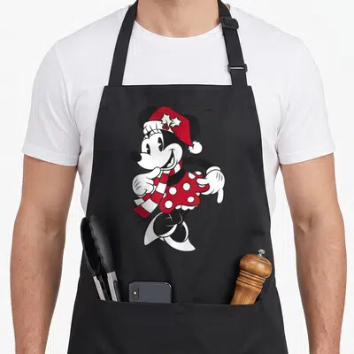 Friend portrait christmas apron - Standing cartoon mouse in red hat, striped scarf, and polka dot dress — shown on a black cotton canvas apron against a white background