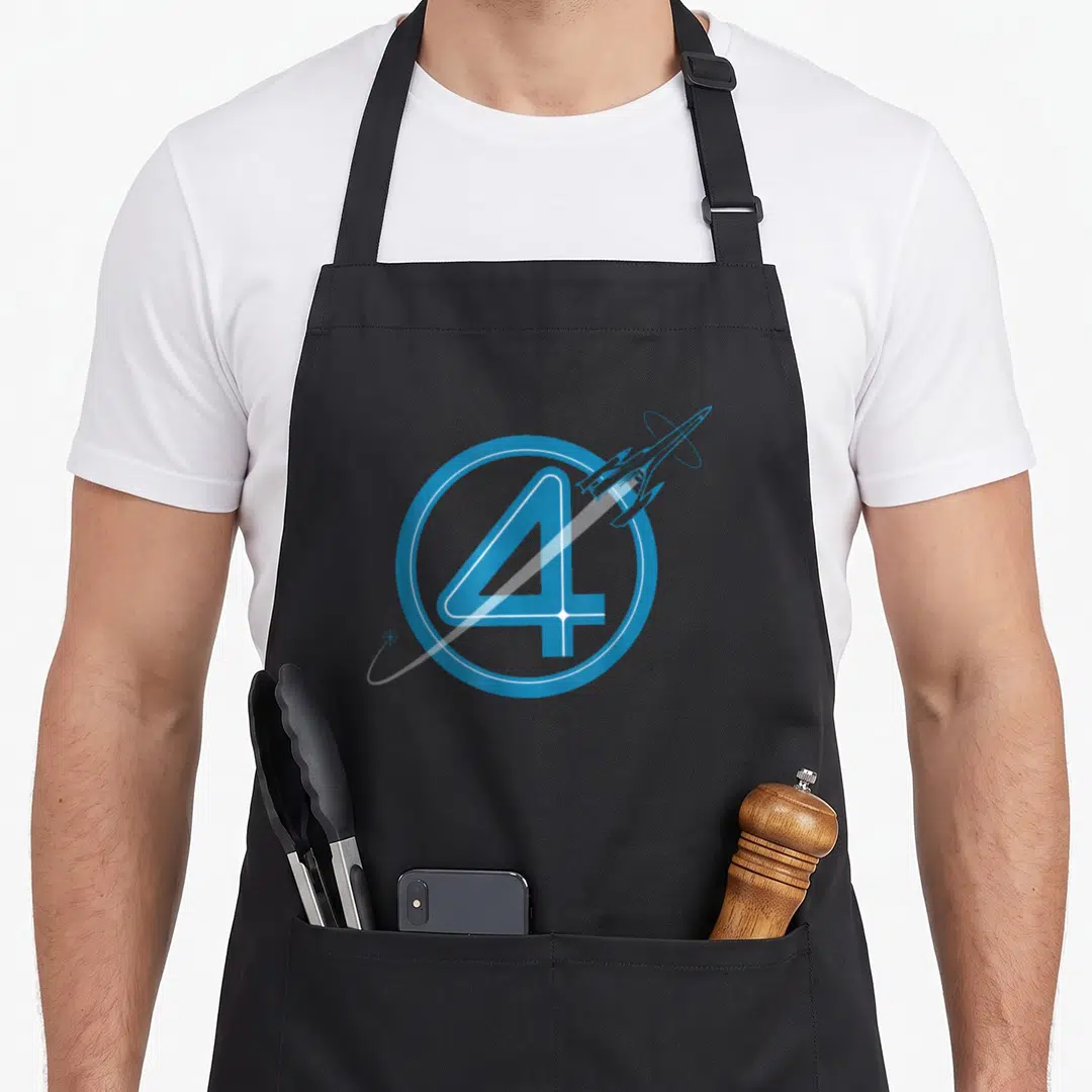 Spacecraft first steps apron - Blue number 4 inside a circle with a rocket ship and orbit line — shown on a black cotton canvas apron against a white background