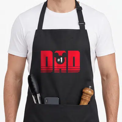 Cute mouse dad apron - Red stylized DND graphic with white #1 in a circle and horizontal stripes — shown on a black cotton canvas apron against a white background