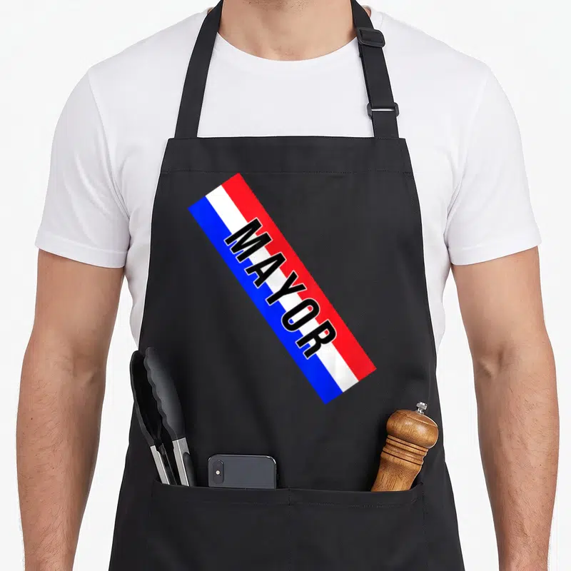 Sash mayor apron - Red white and blue sash with black MAYOR text printed diagonally across the front — shown on a black cotton canvas apron against a white background