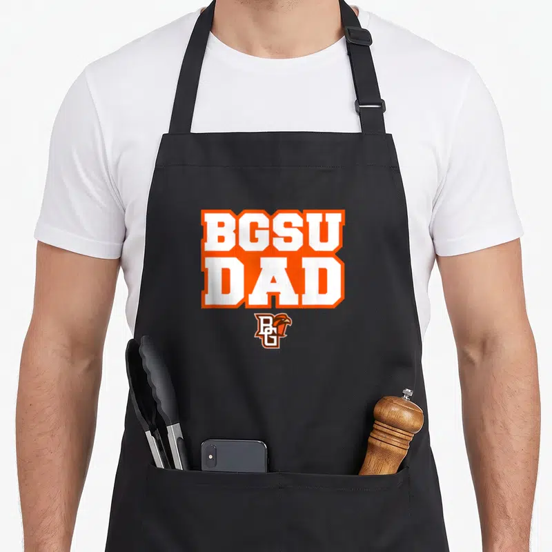 Bowling falcons apron - Stacked BGSU DAD text in orange and white above a small falcon logo — shown on a black cotton canvas apron against a white background