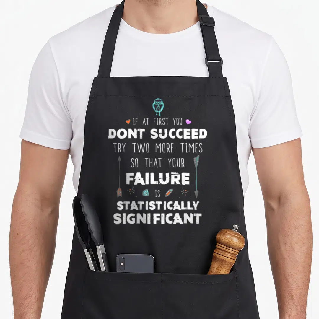 Success chemistry apron - Owl and text reading If At First You Dont Succeed Try Two More Times So That Your Failure Is — shown on a black cotton canvas apron against a white background