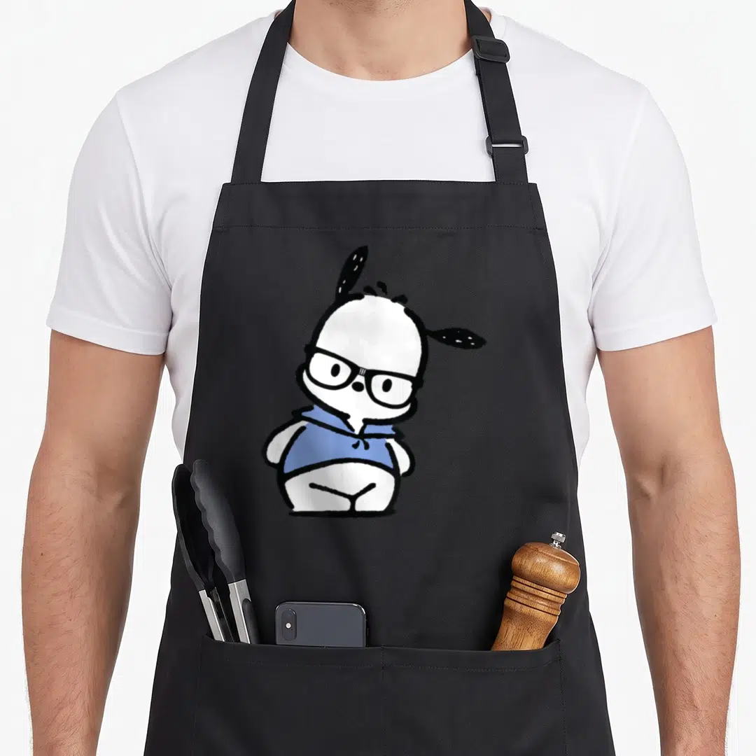 Pochacco nerd apron - Cartoon white dog wearing black glasses and a blue hoodie — shown on a black cotton canvas apron against a white background