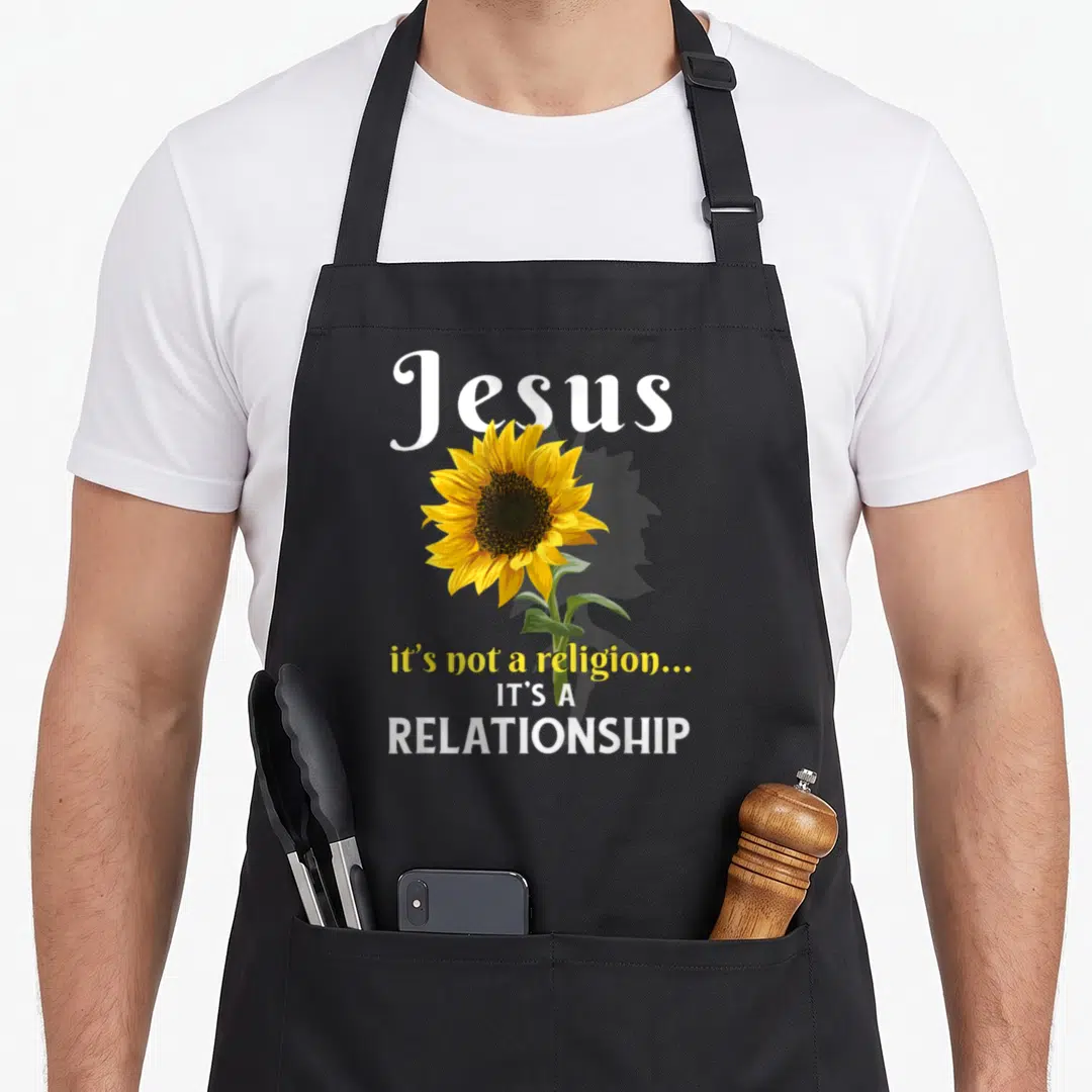 Jesus lover comfort apron - Realistic sunflower with Jesus text and relationship quote on canvas — shown on a black cotton canvas apron against a white background