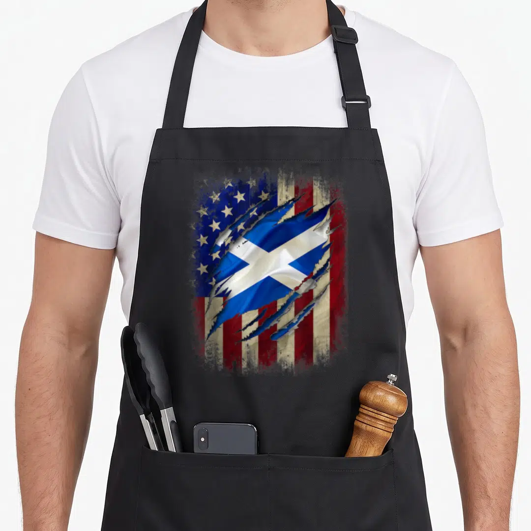 Scottish blood american flag apron - USA flag tearing to reveal Scottish saltire in blue red and white — shown on a black cotton canvas apron against a white background