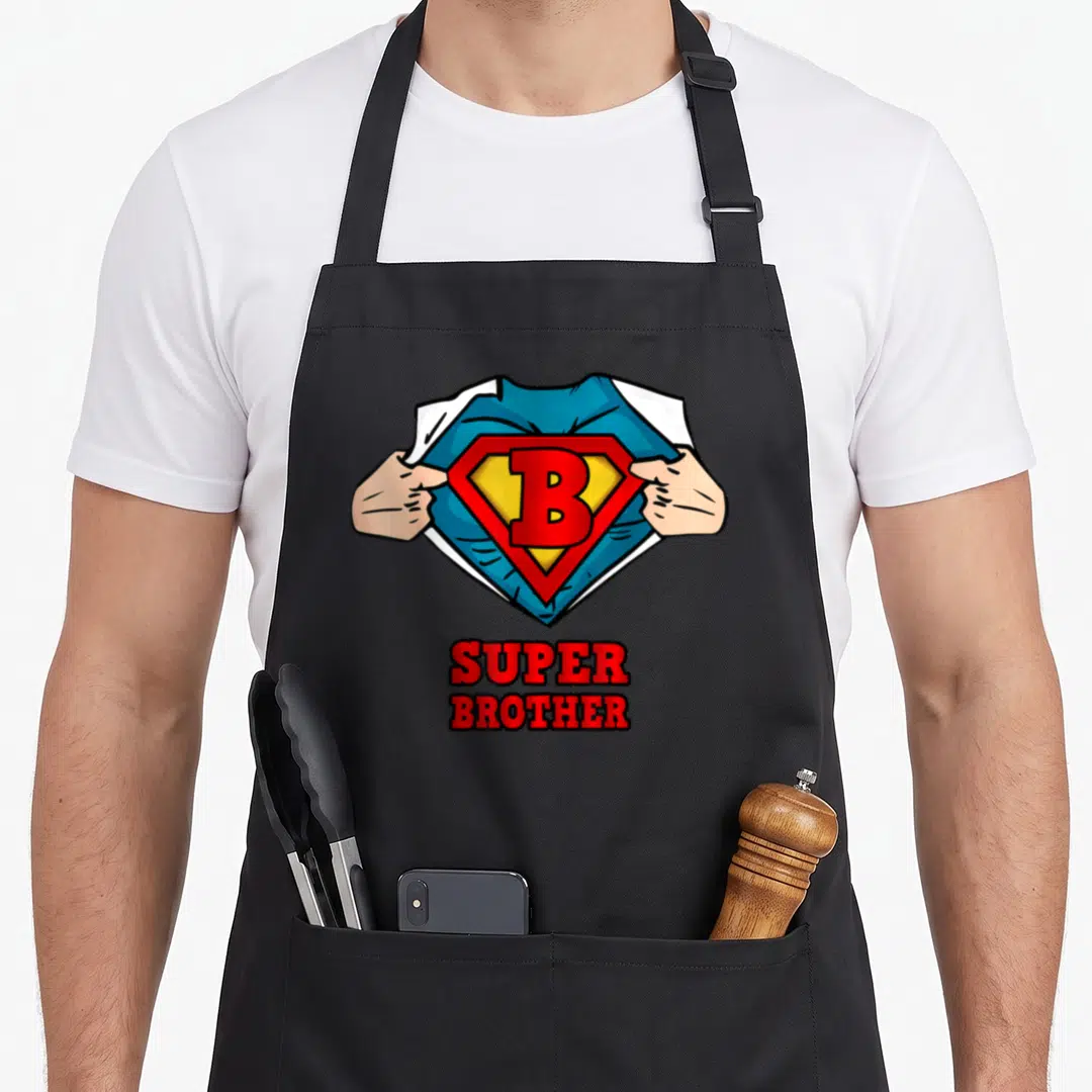 Brother superhero apron - Cartoon hands tearing white shirt to show blue top with red yellow B emblem and text SUPER — shown on a black cotton canvas apron against a white background