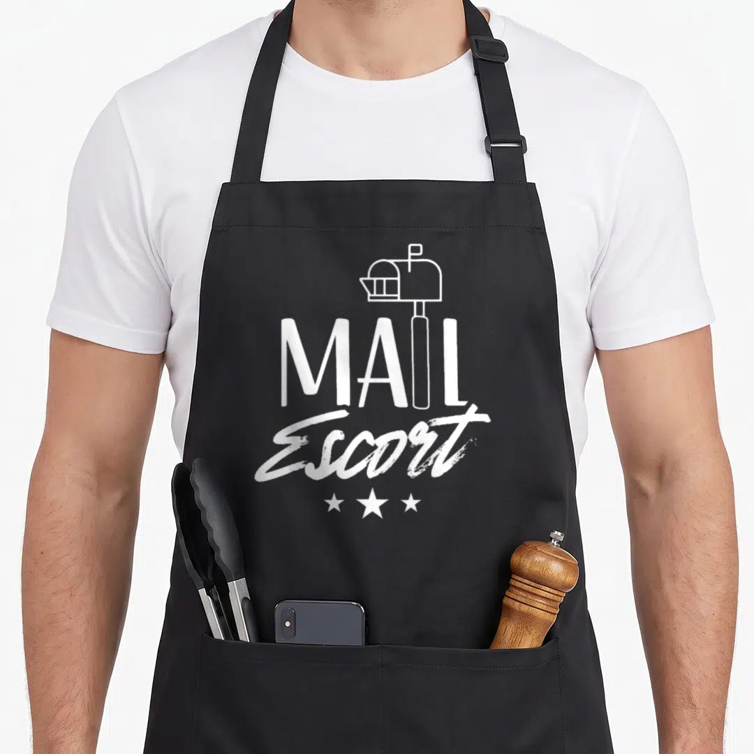 Escort courier postal aprons - White mailbox outline above MAIL Escort text and three stars on black fabric — shown on a black cotton canvas apron against a white background